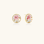 Gold-rimmed circular stud earrings with hand-painted pink peony enamel and pearl accents on white background