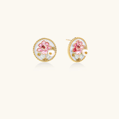 Gold-rimmed circular stud earrings with hand-painted pink peony enamel and pearl accents on white background