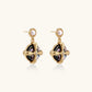 Gold-plated drop earrings with iridescent abalone shell and pearl studs in geometric cross design