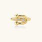 Gold-plated brass ring with safety pin design featuring pavé cubic zirconia stones and dual sphere ends