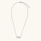 White gold plated necklace with dual-frame geometric pendant featuring crystal pavé border on pale background.