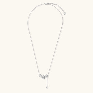 White gold plated Y-shaped necklace with three dimensional flower charms and adjustable drop pendant