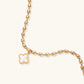 18K gold-plated oval bead chain bracelet with quatrefoil clover charm featuring mother of pearl inlay on cream background