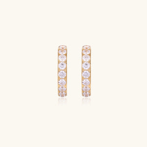 Gold pavé hoop earrings with two freshwater pearls nestled inside the curved design, featuring crystal-studded outer edge.