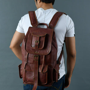 Walnut brown Rictus hiking backpack by Classy Leather Bags, made of durable leather with multiple compartments and adjustable straps.