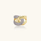 Chunky gold-plated chain-link ring with curved segments and sparkling zirconia crystals on neutral background