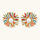 Vibrant starburst stud earrings with multicolor enamel rays and white pearl centers on gold-plated setting