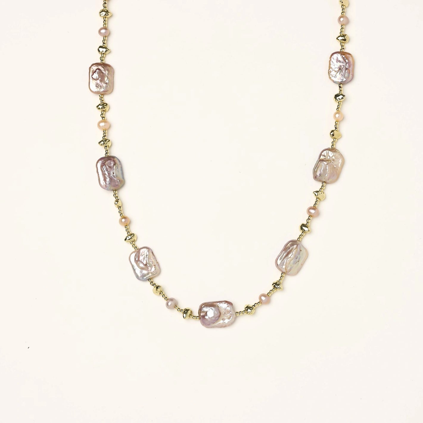 Iridescent baroque pearls alternating with small freshwater pearls on 14K gold-plated chain