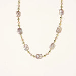 Iridescent baroque pearls alternating with small freshwater pearls on 14K gold-plated chain