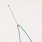 Delicate gold vermeil necklace with teal apatite beads and freshwater pearl on white background.