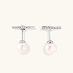 Rhodium-plated sterling silver ear jacket earrings with diamond-set horizontal bar and freshwater pearl drop