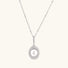 Oval sterling silver pendant with crystal halo surrounding a white freshwater pearl on delicate chain