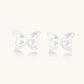 Pair of translucent butterfly-shaped stud earrings with frosted finish and dimensional wing details on white background
