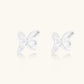 Pair of translucent butterfly-shaped stud earrings with frosted finish and dimensional wing details on white background