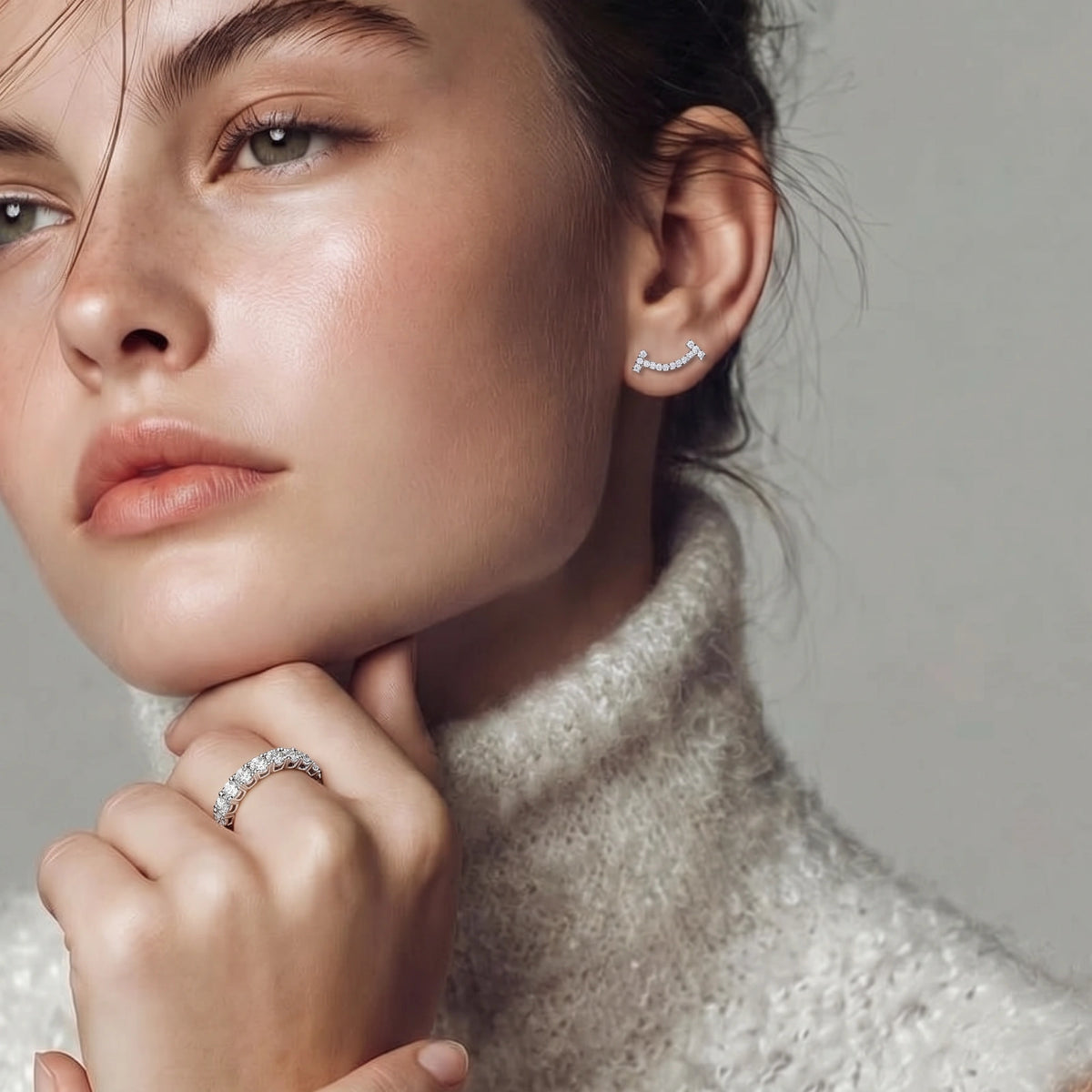 FARNELLI Infinite Sparkle Ring showcasing a sleek band with dazzling gemstone accents on a white background.