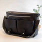Carry Courage NOMAD messenger bag in coal black, structured design with adjustable strap