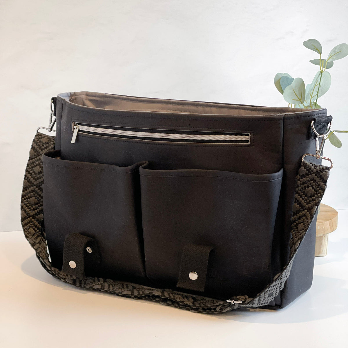 Carry Courage NOMAD messenger bag in coal black, structured design with adjustable strap