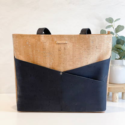 Carry Courage ADVOCATE zippered tote in coal black, shown from the front with handles and zip closure