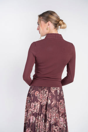 Burgundy Yael Top by Adina Las Vegas featuring a stylish, fitted design with a round neckline and sleeveless style.