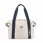 ARTI cream duffle bag with spacious compartment and sturdy handles