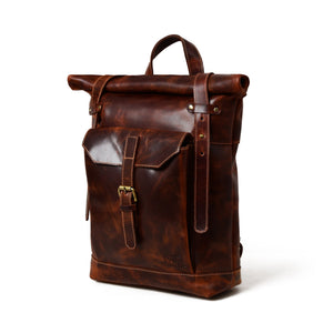 Brown Saddleback Backpack with roll top closure from Classy Leather Bags, featuring durable leather and adjustable straps.