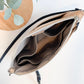 Carry Courage VISIONARY silver crossbody bag with adjustable strap and compact design