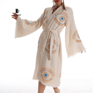 Blue evil eye inspired boho chic caftan by Miyawfashion, flowing fabric with intricate patterns, perfect for stylish summer wear.
