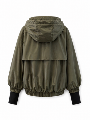 Lightweight Alaska® Outerwear Company windbreaker jacket in bright color, shown folded with zipper and hood visible.