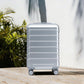 HouseOfZazla 20-inch silver ABS hard shell luggage with four spinner wheels