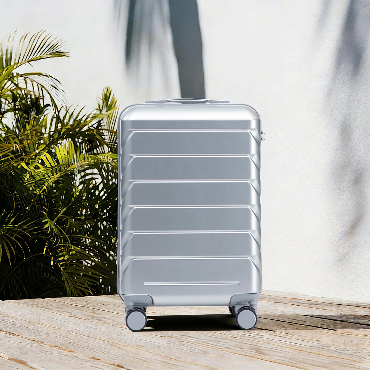 HouseOfZazla 20-inch silver ABS hard shell luggage with four spinner wheels