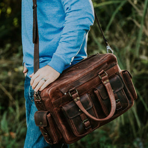 Black leather briefcase from Classy Leather Bags' The Maverick collection with sturdy handles and sleek design.