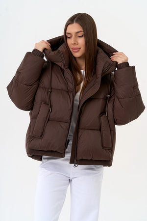 Alaska® Outerwear Company dark chocolate insulated bio-down coat, showcasing its stylish design and warm, insulated exterior.