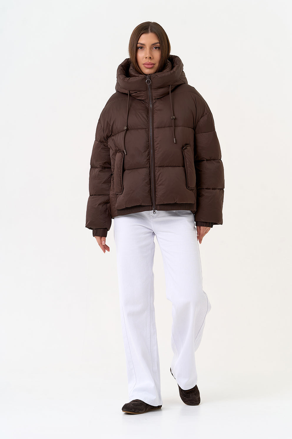 Alaska® Outerwear Company dark chocolate insulated bio-down coat with a hood, designed for warmth and style in cold weather.