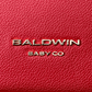 Baldwin Baby Company Daphne diaper bag in crimson with close-up logo detail