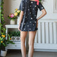 Heimish Full Size Star Print Asymmetrical Neck Short Sleeve Top - Farnelli