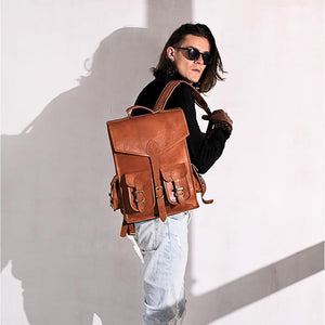 Vintage leather backpack rucksack by Classy Leather Bags, showing durable brown leather with adjustable straps and multiple compartments.