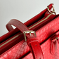 Baldwin Baby Company Montrose diaper bag tote in cardinal with close-up view of shoulder strap