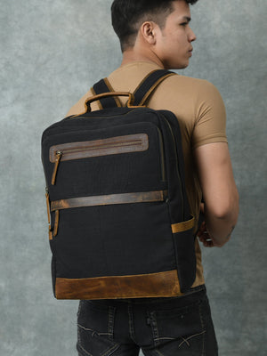 Classy Leather Bags Foster Canvas Backpack with adjustable straps, front pocket, and durable canvas material, suitable for daily use.