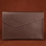 Genuine leather Rirati men's briefcase with large capacity, cowhide design, featuring sturdy handles and multiple compartments.
