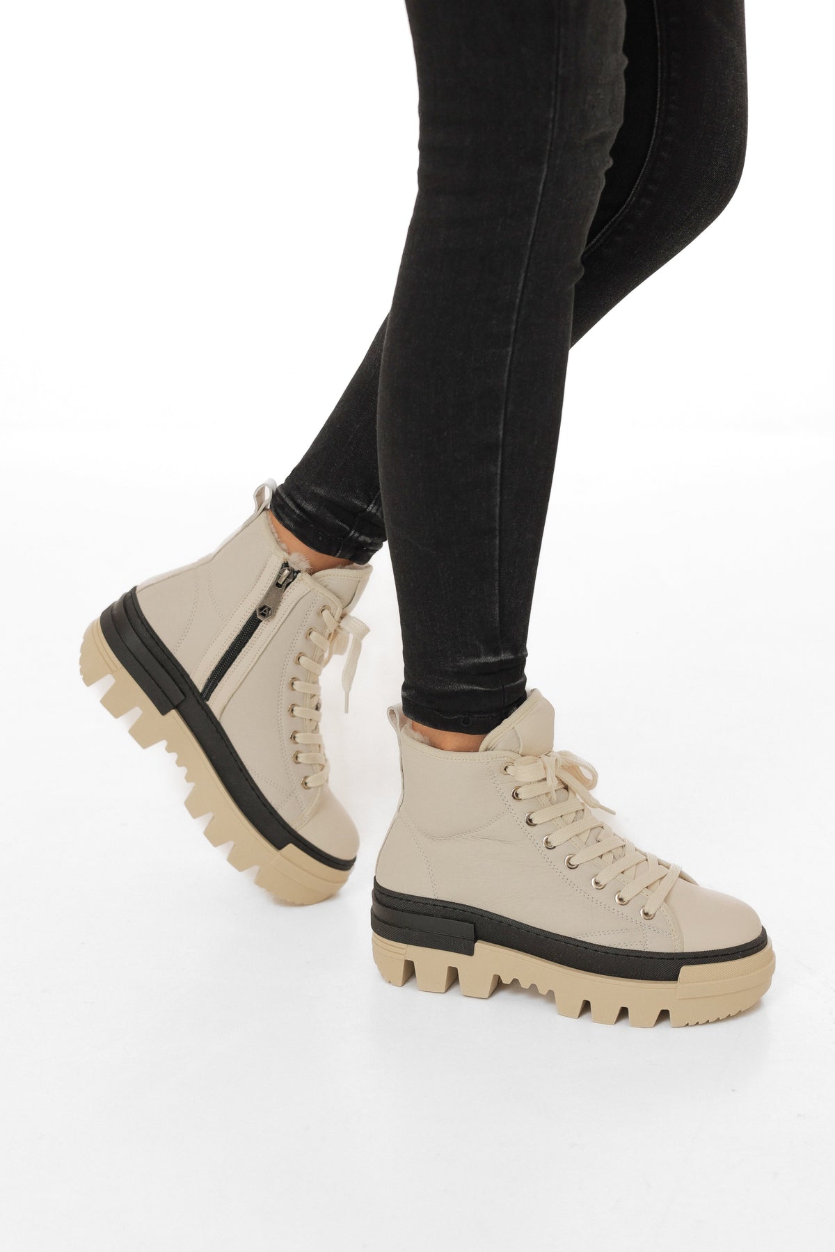Alaska® Outerwear Company Aspen genuine shearling lined winter boots with leather exterior and sturdy rubber soles.
