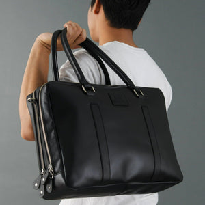 Black buffalo leather laptop briefcase from Classy Leather Bags, featuring a sleek design with sturdy handles and secure zipper closure.