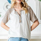 Heimish Full Size Animal Print Half Button Short Sleeve Top - Farnelli