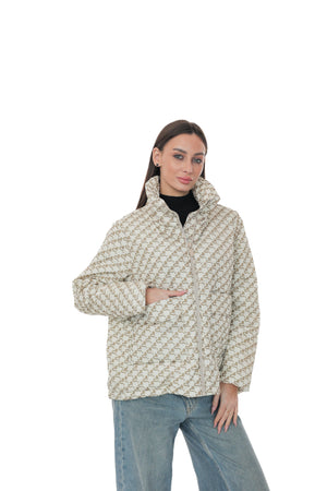 Light Demi-Season jacket by Alaska® Outerwear Company shown hanging on a wooden hanger, featuring a sleek design and neutral color.
