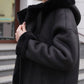 Alaska Outerwear Company Grazia reversible black faux shearling hooded coat parka pose.