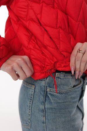 Light quilted jacket by Alaska® Outerwear Company, showing a close-up of the padded, insulated jacket fabric and design.