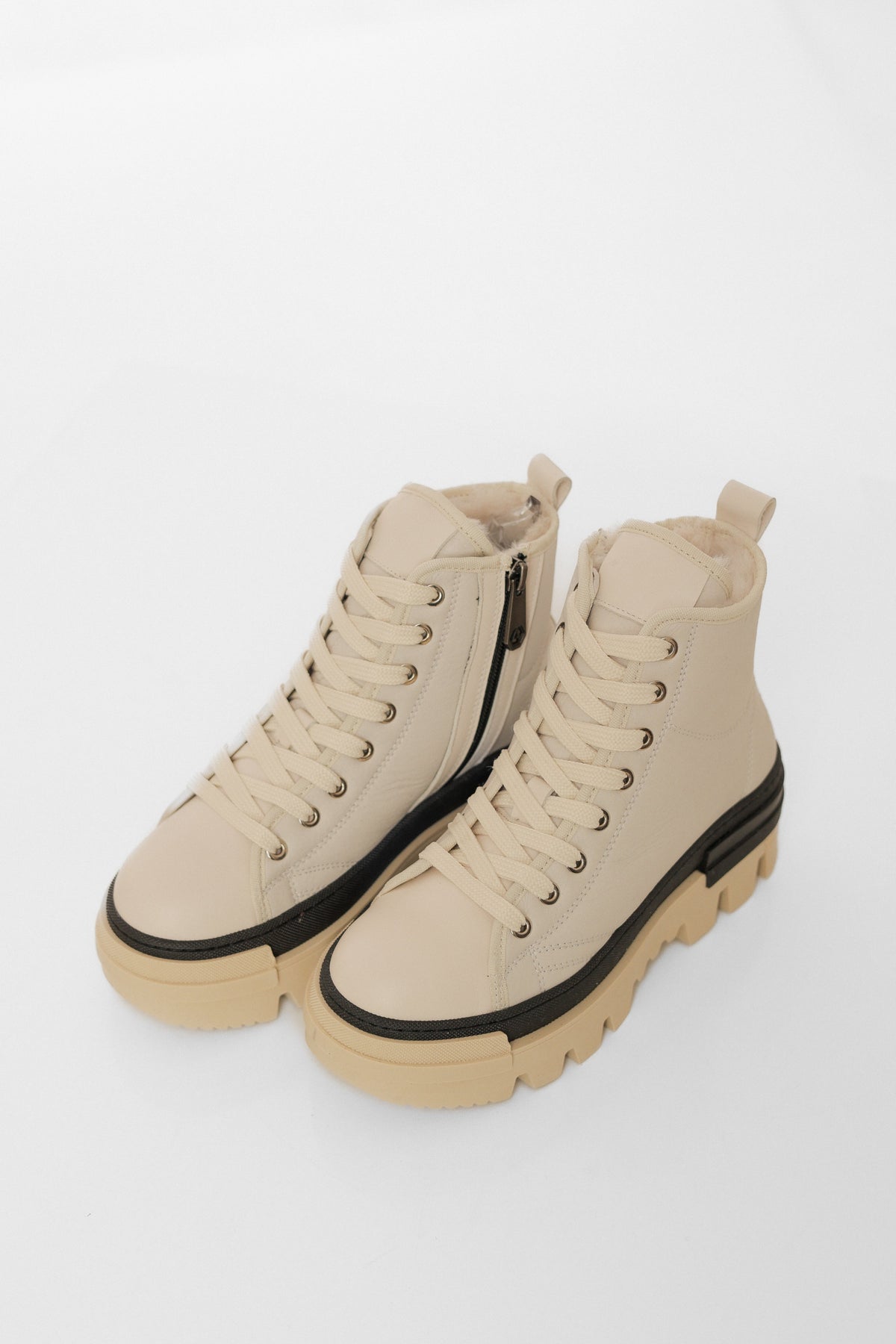 Alaska® Outerwear Company Aspen genuine shearling lined winter boots with rugged design and warm interior for cold weather.