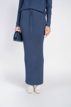 Adina Las Vegas Ribbed Sweater Skirt in Moonbeam color, featuring a fitted design and ribbed texture, styled with a casual chic look.