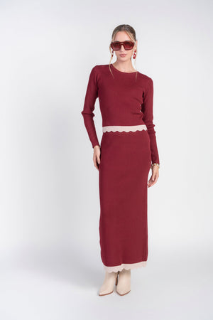 Bordeaux scalloped knit skirt by Adina Las Vegas, showcasing a stylish, textured design with a flattering fit.