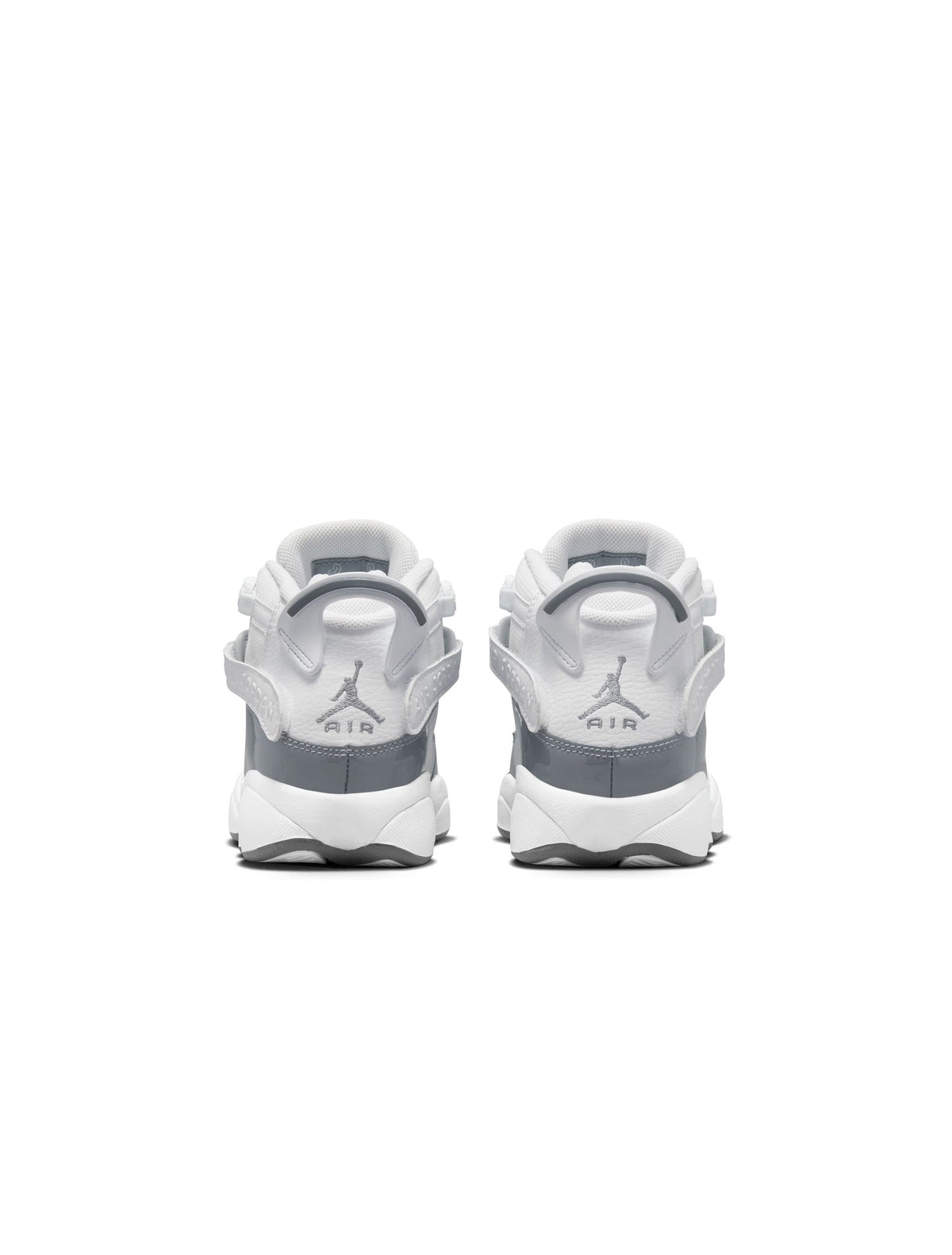White and Cool Grey Air Jordan 6 Rings gradeschool sneakers featuring Nike and Jordan branding, displayed on a plain background.