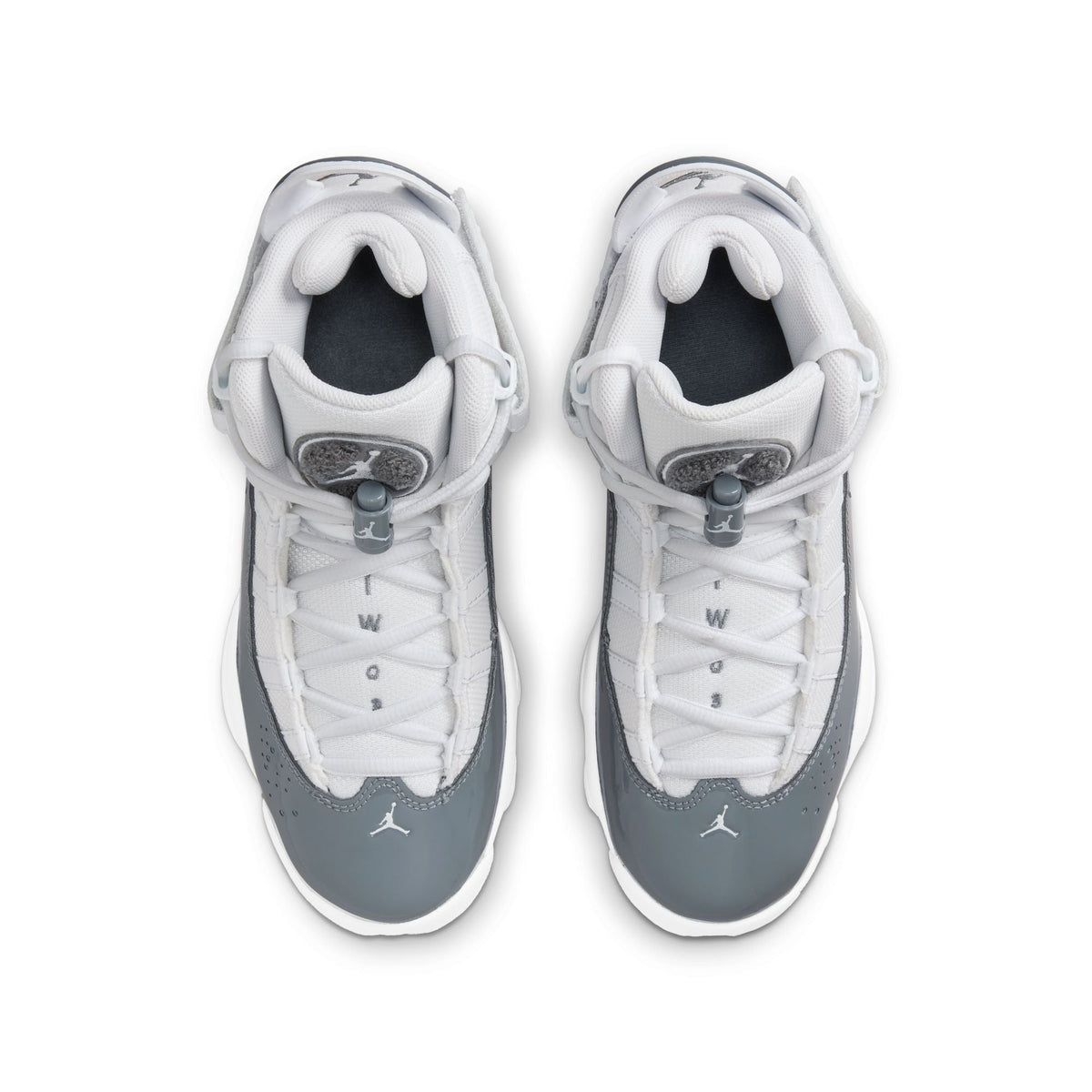 White and cool grey Air Jordan 6 Rings grade school sneakers by Denim Exchange, featuring sleek design and athletic style.